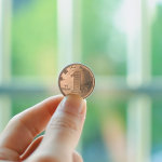 coin being held for achievement